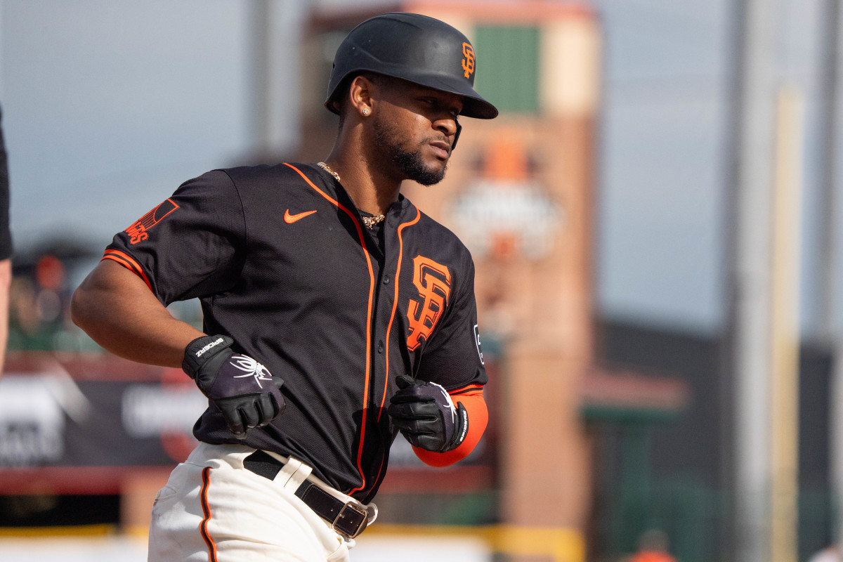 San Francisco Giants infielder Otto Lopez (54) rounds third after a home run in the ninth against the Chicago Cubs during a spring training game at Scottsdale Stadium.